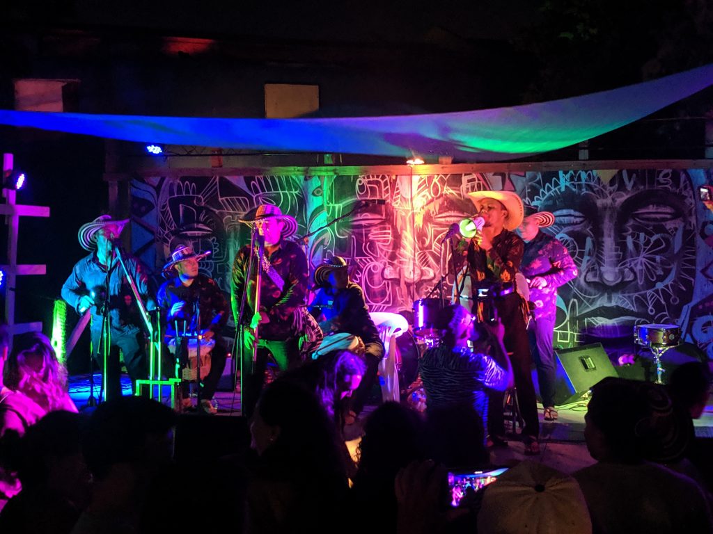 Live band performing on stage at Kenny Dorham's Backyard in Austin, Texas.