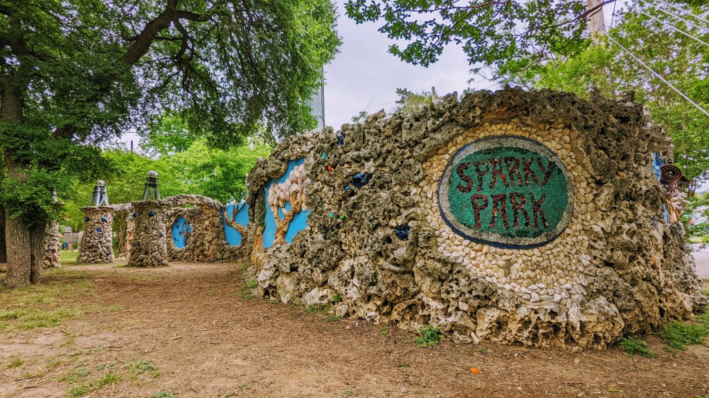 Sparky Park, Austin, Texas. A weird arty park. Electrical equipment used as an artistic canvas. A mural that says Sparky Park.
