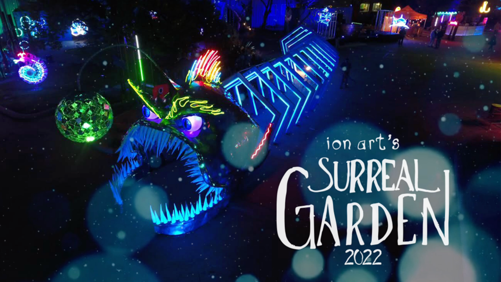 A neon dragon in an immersive neon setting with text overlay that says 'Ion Art's Surreal Garden 2022'.